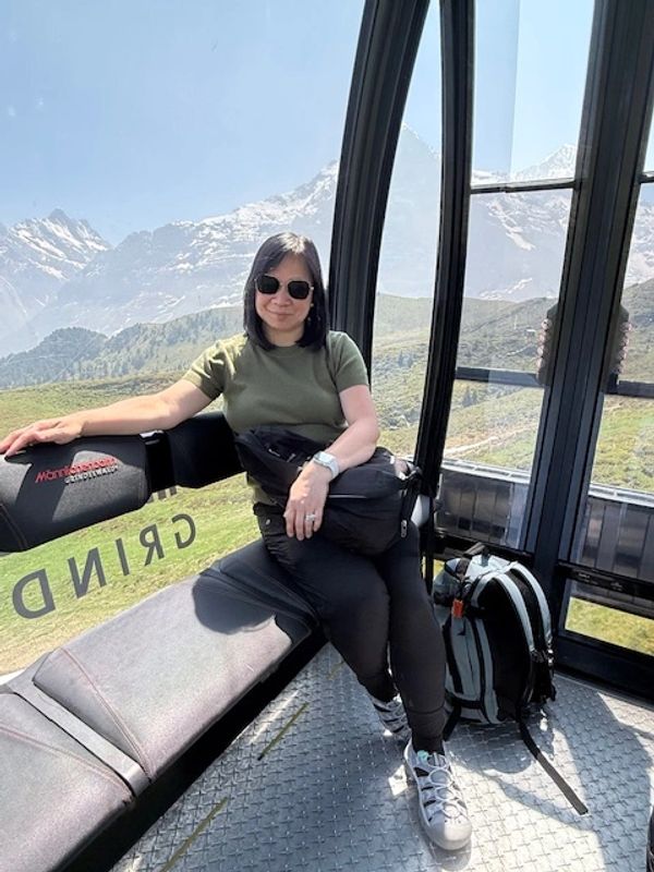 Lady riding a gondola. The independent travel agent of Toastie Potato Travel Adventure.