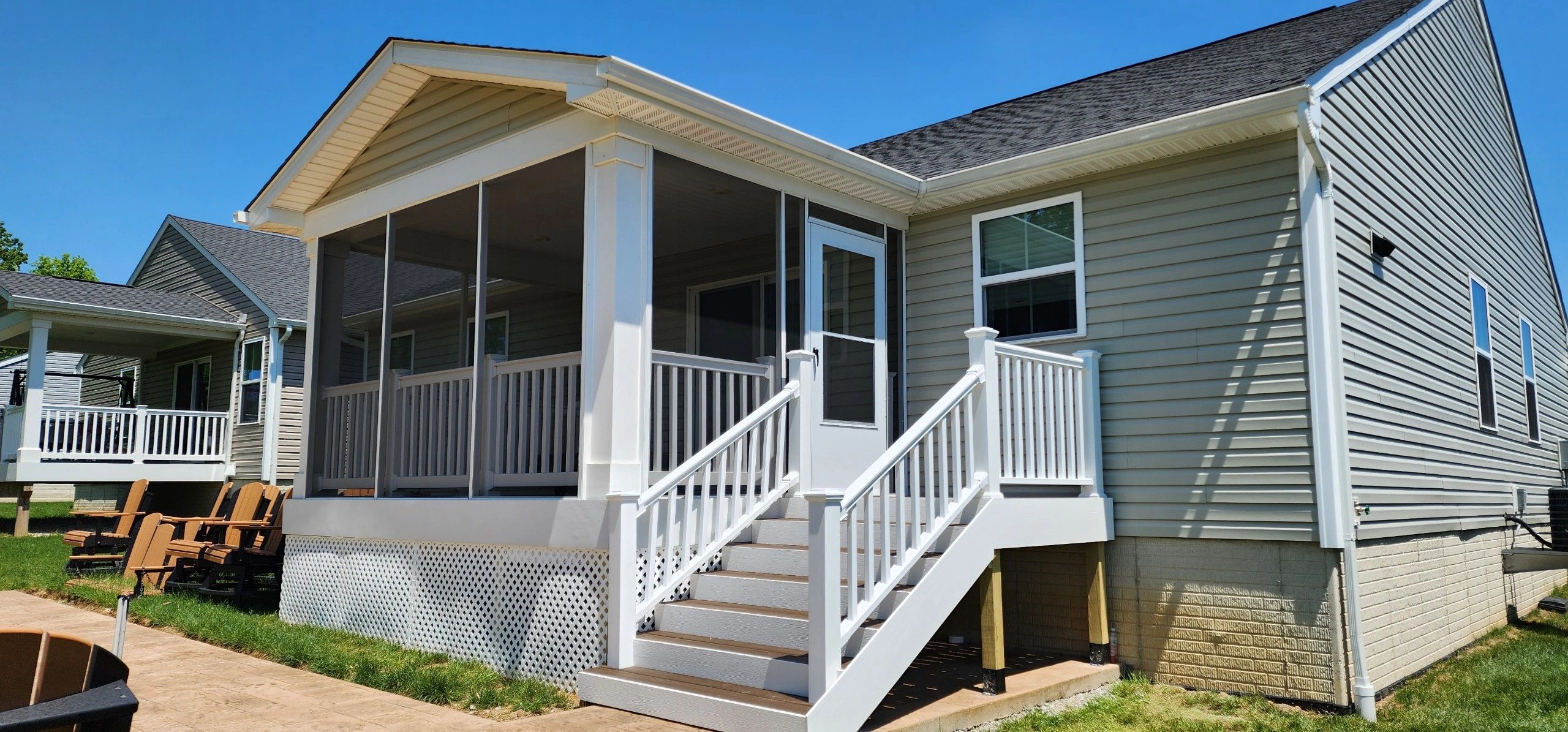 Deck steps and landing that we built for a client, with an extruded aluminum frame screen system.