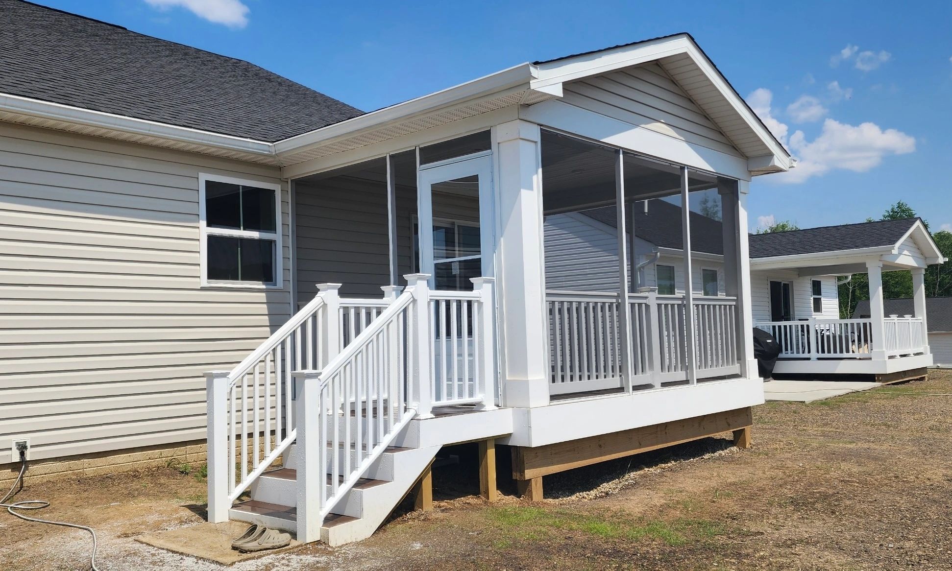 Deck and outdoor steps with screened in porch