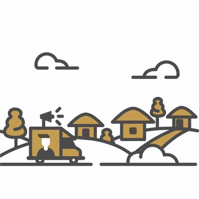 A small village with houses, trees, and a delivery truck on a road.