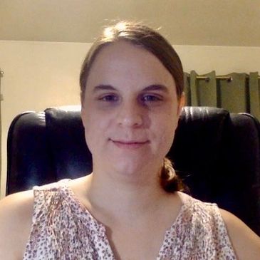 A woman’s bright smile, focused gaze ahead