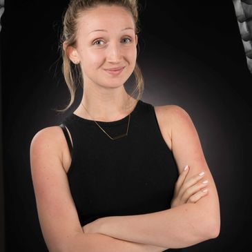 A woman’s face lit with a smile, gazing forward