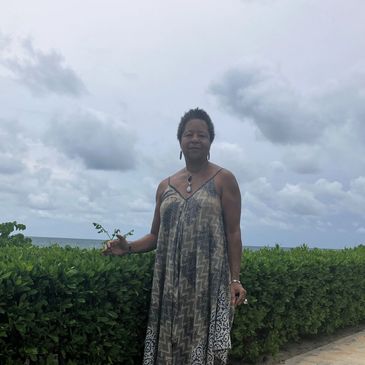 Dada Ra standing near bushes