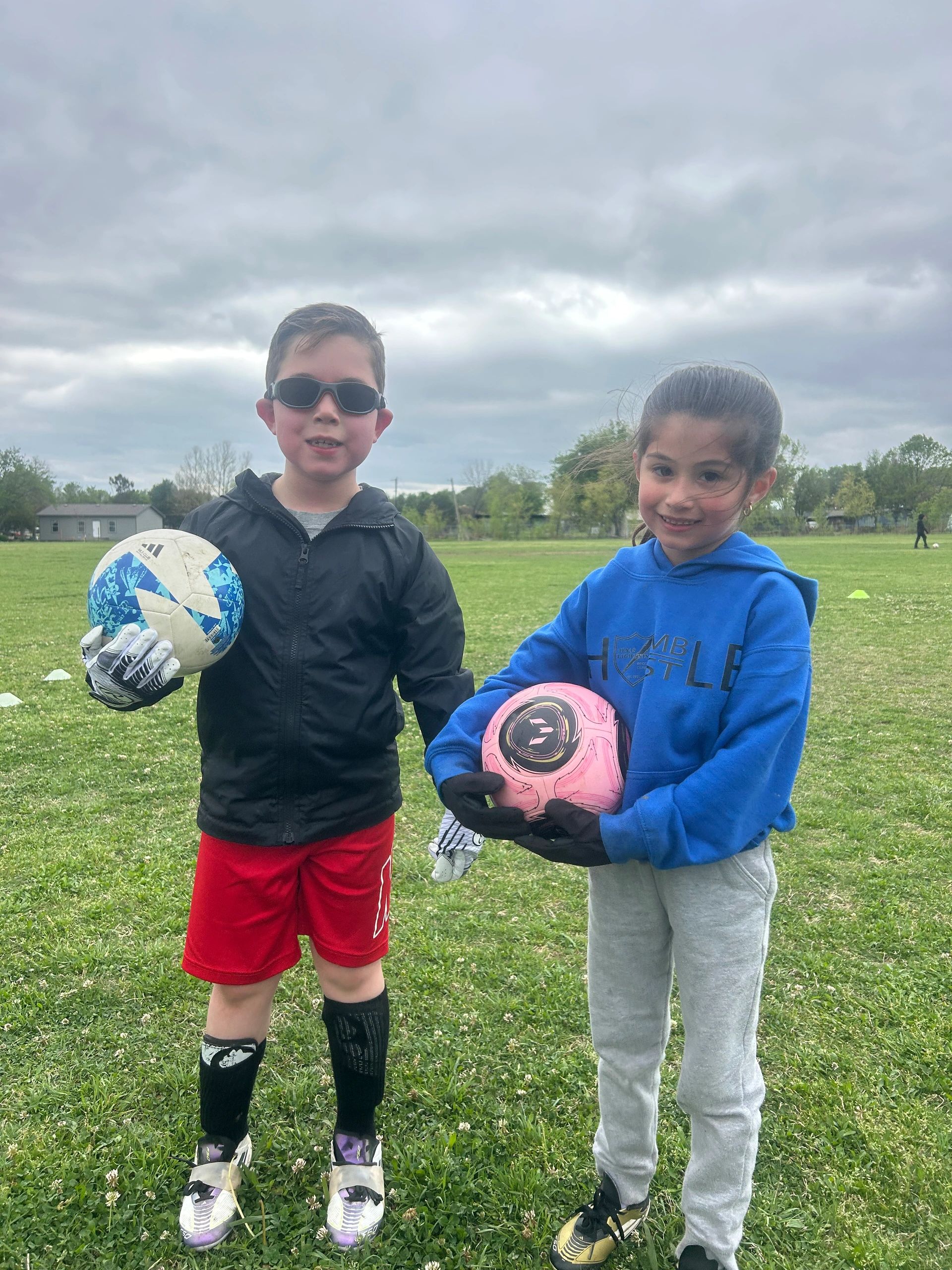 Two young players at the end of their soccer training session