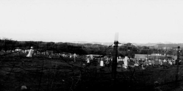 Double pinhole photograph of a cemetery in Hernandez, NM. 