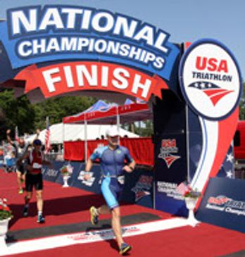 Man running marathon on urban street with crowd