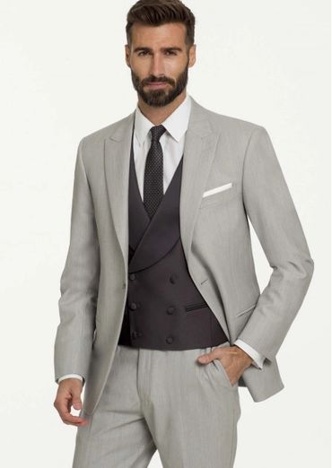 light grey jacket , slacks, double breasted dark grey vest and tie, white shirt and pocket square