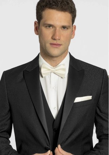 black tux with white shirt and bow tie