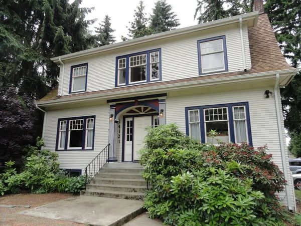 house with bushes in the front