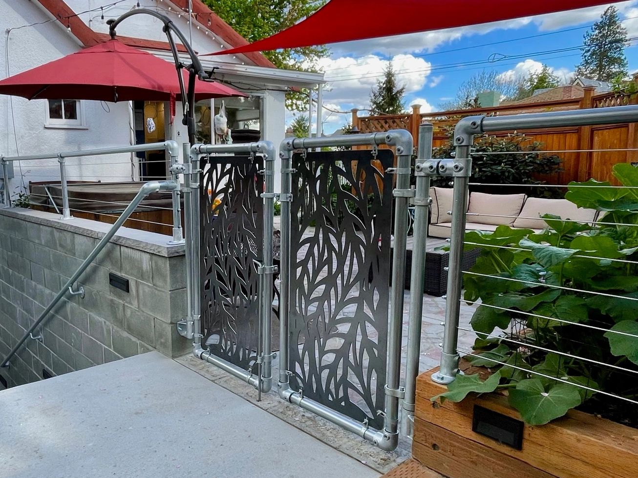Custom metal gate panels by the Koi Lagoon in Fort Collins