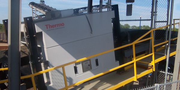 Thermo Fisher Scientific analyzer hardware installed on a scrap conveyor