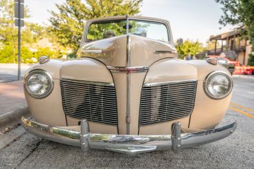 Front view of a classic beige Mercury car.