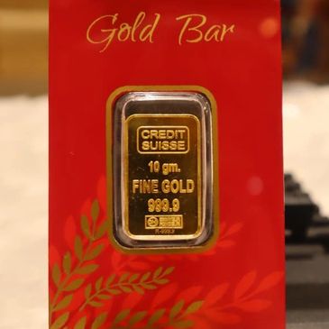 A gold coin placed in a coin holder.