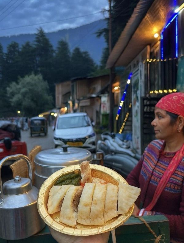 Street food with a scenic mountain backdrop.