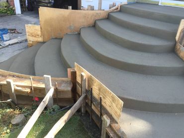 residential steps - concrete dual access curved broom finish entryway steps (view 1) 