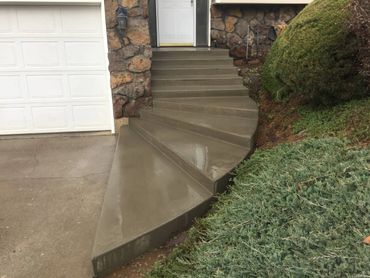residential steps - concrete semi-spiral broom finish entryway steps
