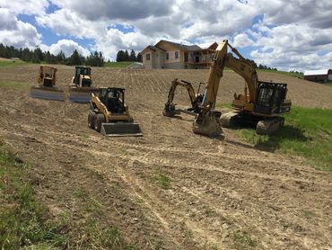 residential excavation - landscape grading with dozer, skid steer, trackhoe, and backhoe