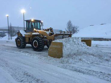 commercial excavation - snow plowing with wheel loader and pusher