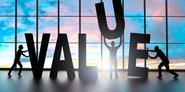three people pushing together the word value