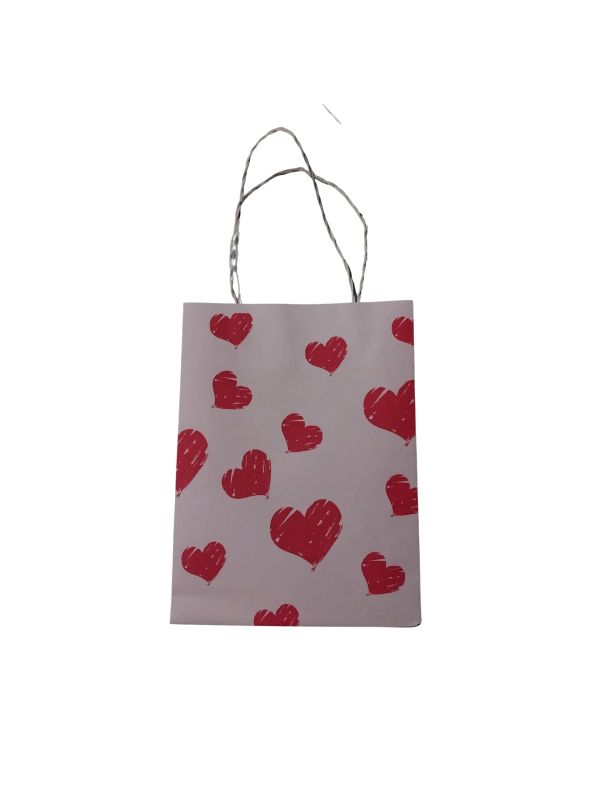 Gift bag with red hearts design.