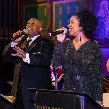 A singing trio from the David Rothstein Chicago Wedding Band at a corporate event.