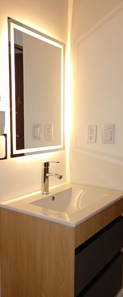 Instalación de espejos con luz