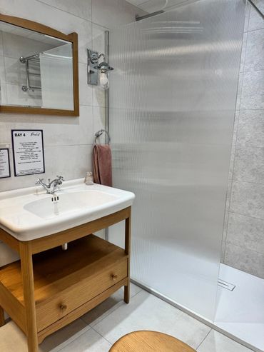 Traditional wood display from our showroom with a fluted shower screen