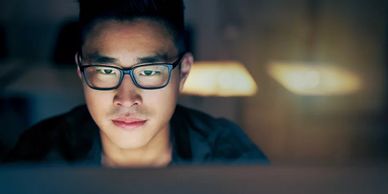 wearing blue light filter glasses to help with eye strain, fatigue and regular sleep patterns.