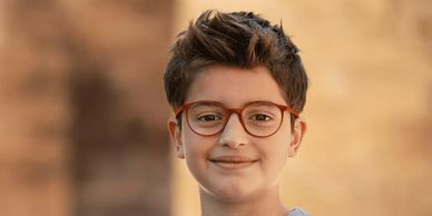 kid wearing glasses with specialised Hoya lenses for myopia progression control