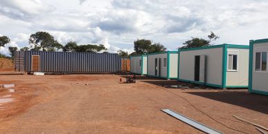 Temporary container offices arranged on a construction site.