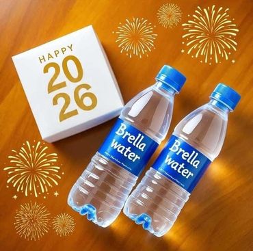 Two bottles of Brella water with a Happy 2026 box and festive fireworks graphics.