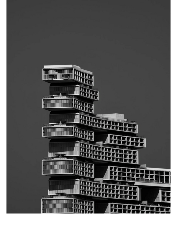 Modern architectural building with layered, protruding rectangular sections.