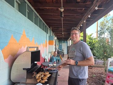 Adam barbecuing on the back porch of the clubhouse.