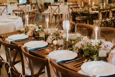 Romantic country candle-lit wedding reception dinner at The Barn at Firefly Lane wedding venue.