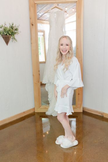 Bride getting ready in the bridal suite at The Barn on her wedding day at Firefly Lane.