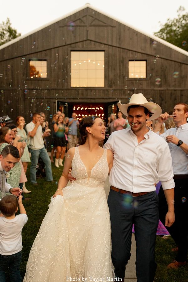 Bubble send-off at the modern black barn venue, The Barn at Firefly Lane Weddings.