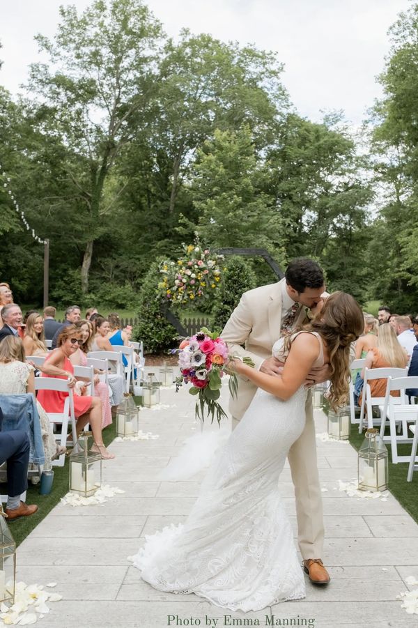 Colorful spring garden ceremony at the Firefly Lane Barn wedding venue in Nashville, TN.