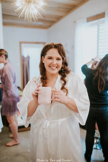 Nashville wedding venue bridal suite at Firefly Lane. Bride holding coffee getting ready for wedding