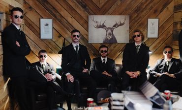 Funny groomsmen photo getting ready in the Groom's suite at Firefly Lane.