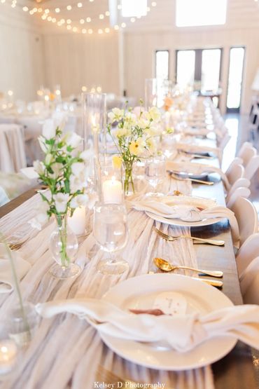 White, french-inspired wedding tablescape for a wedding reception at Firefly Lane wedding venue.
