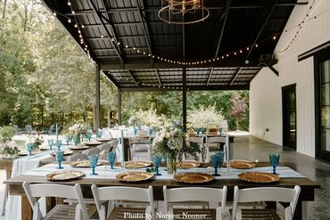 Outdoor wedding reception with French Country tablescape at The Barn at Firefly Lane Weddings.
