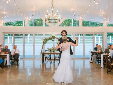 Bride and groom's first dance in the glass reception building at Firefly Lane.