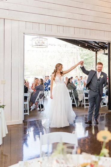 Romantic wedding first dance under soft lighting at a barn reception venue in Nashville, Tennessee.