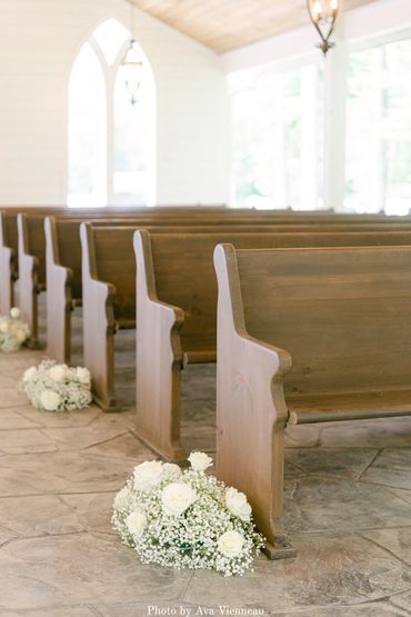 Handcrafted wooden pews in The Chapel at Firefly Lane wedding venue in Dickson, TN.