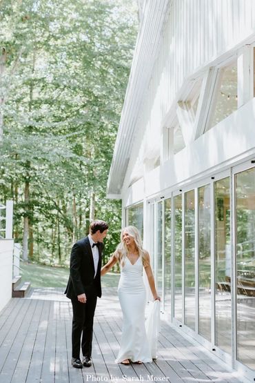 Bride and groom at the white chapel's reception hall at Firefly Lane chapel venue.