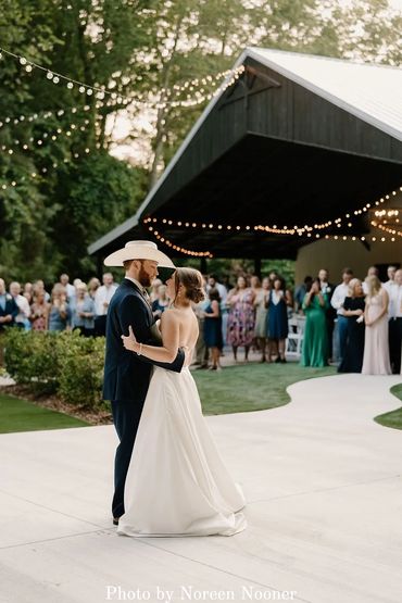 Dance the night away under the firefly lights on the outdoor patio at Firefly Lane's barn venue.