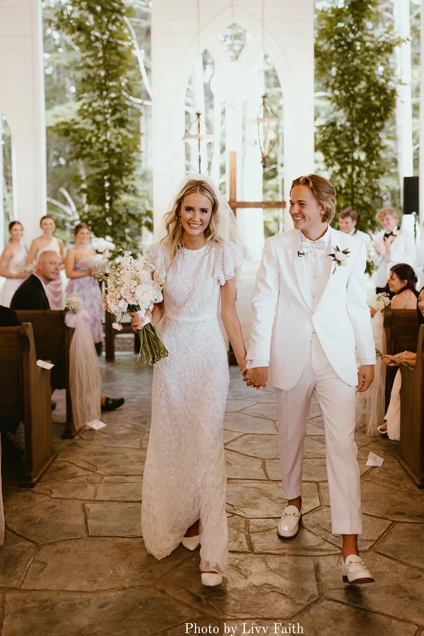Bride and groom walking down the aisle in The Chapel at Firefly Lane wedding venue in Tennessee.