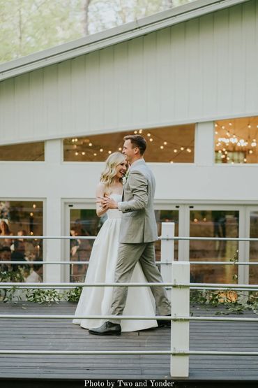 Bride and groom dancing outside on the back deck at The Chapel.