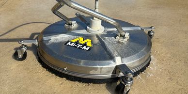 24" surface leaner cleaning a driveway