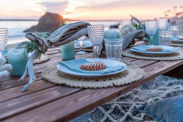 sideview of dining table decor with sunset in the background